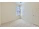 Carpeted bedroom with a closet and window at 448 Bonanza Dr, Erie, CO 80516