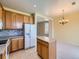 Bright kitchen with an island and stainless steel appliances, adjacent to dining area at 448 Bonanza Dr, Erie, CO 80516