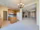 Open floorplan featuring spacious living room with fireplace, seamlessly connected to kitchen at 448 Bonanza Dr, Erie, CO 80516