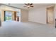 An open concept living room looking into a kitchen and dining area with lots of space at 448 Bonanza Dr, Erie, CO 80516