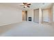 Spacious living room with neutral carpet, fireplace, and ample natural light at 448 Bonanza Dr, Erie, CO 80516