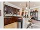 A fully equipped bar with wooden cabinets, granite counters, and a stainless steel trash can at 1279 Estates Dr, Breckenridge, CO 80424
