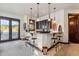 Wet bar with granite counters, seating for four, and decorative accents with views of the snowy outdoors at 1279 Estates Dr, Breckenridge, CO 80424