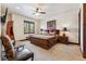 Bedroom with wooden bed frame, chair, and large window overlooking the neighborhood at 1279 Estates Dr, Breckenridge, CO 80424