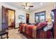 Cozy bedroom with ensuite bathroom, TV, wooden accents, and a view of the snowy landscape at 1279 Estates Dr, Breckenridge, CO 80424