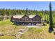Stylish mountain home with entertainment deck, hot tub, gas fire pit, and stone steps at 1279 Estates Dr, Breckenridge, CO 80424