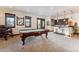 Entertaining game room with a pool table, bar, and mountain views at 1279 Estates Dr, Breckenridge, CO 80424
