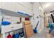 Garage space with white storage cabinets, workbench, and items neatly organized at 1279 Estates Dr, Breckenridge, CO 80424