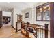 Hallway features wood floors, trim, staircase, view windows, and decor at 1279 Estates Dr, Breckenridge, CO 80424