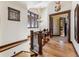 Elegant hallway features wood floors, trim, staircase, view windows, and decor at 1279 Estates Dr, Breckenridge, CO 80424