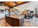 Spacious kitchen island with granite countertops and custom wood cabinetry, adjacent to the dining area at 1279 Estates Dr, Breckenridge, CO 80424