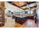 Open-concept kitchen with island, granite countertops, dark wood cabinetry, and views at 1279 Estates Dr, Breckenridge, CO 80424
