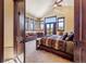 Spacious main bedroom boasts large windows, vaulted ceilings, and mountain views at 1279 Estates Dr, Breckenridge, CO 80424