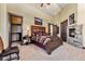 This expansive main bedroom features a cozy stone fireplace, carpeted floors, and elegant dark wood trim at 1279 Estates Dr, Breckenridge, CO 80424