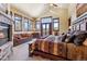 Main bedroom features a stone fireplace, seating area, and bright mountain views at 1279 Estates Dr, Breckenridge, CO 80424