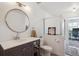 Well-lit bathroom featuring a vanity, contemporary fixtures and glass shower at 6741 S Ivy Way # B4, Centennial, CO 80112