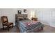 Cozy bedroom featuring neutral paint, a wood headboard, and an ample closet at 6741 S Ivy Way # B4, Centennial, CO 80112