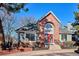 Charming clubhouse with brick facade, arched window and red door at 6741 S Ivy Way # B4, Centennial, CO 80112