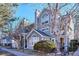 Inviting townhome with charming architectural details and mature landscaping, creating a warm and welcoming curb appeal at 6741 S Ivy Way # B4, Centennial, CO 80112