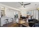 Spacious living area with an open layout, connecting seamlessly to the kitchen and dining area, perfect for modern living at 6741 S Ivy Way # B4, Centennial, CO 80112
