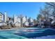 View of the community pool surrounded by well-maintained townhouse units at 6741 S Ivy Way # B4, Centennial, CO 80112