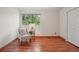 Bedroom has a large window with outdoor views, and a comfortable accent chair at 7999 Centrebridge Dr, Niwot, CO 80503