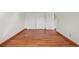 Bedroom featuring wood floors and a double-door closet at 7999 Centrebridge Dr, Niwot, CO 80503