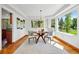 Bright dining room with modern decor, a stylish table, and large windows overlooking the scenic outdoors at 7999 Centrebridge Dr, Niwot, CO 80503
