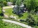 Aerial view of the home with a lush lawn, back deck and easy access to LoBo Trail at 7999 Centrebridge Dr, Niwot, CO 80503