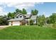Charming two-story home with a well-manicured lawn and mature trees offering a peaceful curb appeal at 7999 Centrebridge Dr, Niwot, CO 80503