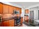 Kitchen boasts wood cabinetry, granite counters, stainless steel appliances, and tile backsplash at 7999 Centrebridge Dr, Niwot, CO 80503