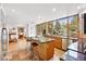 Open kitchen featuring an island with seating, stainless appliances, and a lovely view of the backyard at 7999 Centrebridge Dr, Niwot, CO 80503