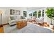 Bright living room with hardwood floors, a cozy sofa, and large windows offering plenty of natural light at 7999 Centrebridge Dr, Niwot, CO 80503