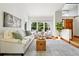 Inviting living room with a comfortable sofa, stylish decor, and a view of the outdoors through large windows at 7999 Centrebridge Dr, Niwot, CO 80503