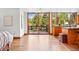 Spacious living room with hardwood floors, a sliding glass door to the deck, and an open floor plan at 7999 Centrebridge Dr, Niwot, CO 80503