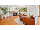 Inviting living room features a fireplace, hardwood floors, and a comfortable seating area with natural lighting at 7999 Centrebridge Dr, Niwot, CO 80503