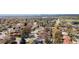 An aerial view of the neighborhood with city views in the distance at 6981 Zuni St, Denver, CO 80221