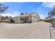 Large concrete patio connects the garage and back of the home at 6981 Zuni St, Denver, CO 80221