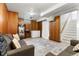 Cozy basement featuring carpet, wood paneling, and comfortable seating area at 6981 Zuni St, Denver, CO 80221