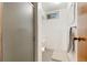 Classic bathroom includes a toilet, shower stall, and tiled walls at 6981 Zuni St, Denver, CO 80221