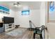 A basic bedroom featuring a TV, treadmill, and decor at 6981 Zuni St, Denver, CO 80221
