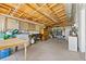 Spacious garage with ample storage, workbench, and concrete floor at 6981 Zuni St, Denver, CO 80221