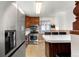 Functional kitchen featuring stainless steel appliances, a breakfast bar, and ample storage at 6981 Zuni St, Denver, CO 80221