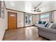 Inviting living room featuring hardwood floors, natural light, and stylish furnishings at 6981 Zuni St, Denver, CO 80221