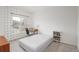 Stylish bedroom with a large window, desk area, and unique patterned wallpaper at 8707 E Florida Ave # 510, Denver, CO 80247