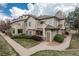 Inviting two-story townhome featuring neutral siding, a cozy balcony, and well-maintained landscaping at 8707 E Florida Ave # 510, Denver, CO 80247