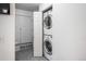 Convenient laundry room with stacked washer and dryer next to the closet at 8707 E Florida Ave # 510, Denver, CO 80247