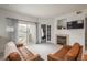 Spacious living area with a fireplace, balcony access, and open view into an adjacent bedroom at 8707 E Florida Ave # 510, Denver, CO 80247