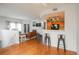 Bright living room with hardwood floors flowing into an open-concept kitchen at 8707 E Florida Ave # 510, Denver, CO 80247