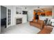 Cozy living room featuring a fireplace, mounted TV, and seamless access to the updated kitchen at 8707 E Florida Ave # 510, Denver, CO 80247
